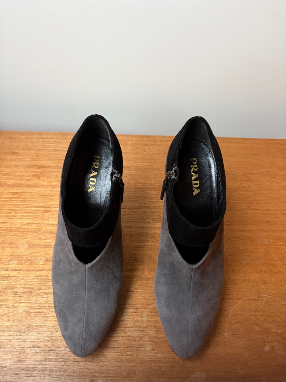 Prada gray suede pumps with black collar and side zipper